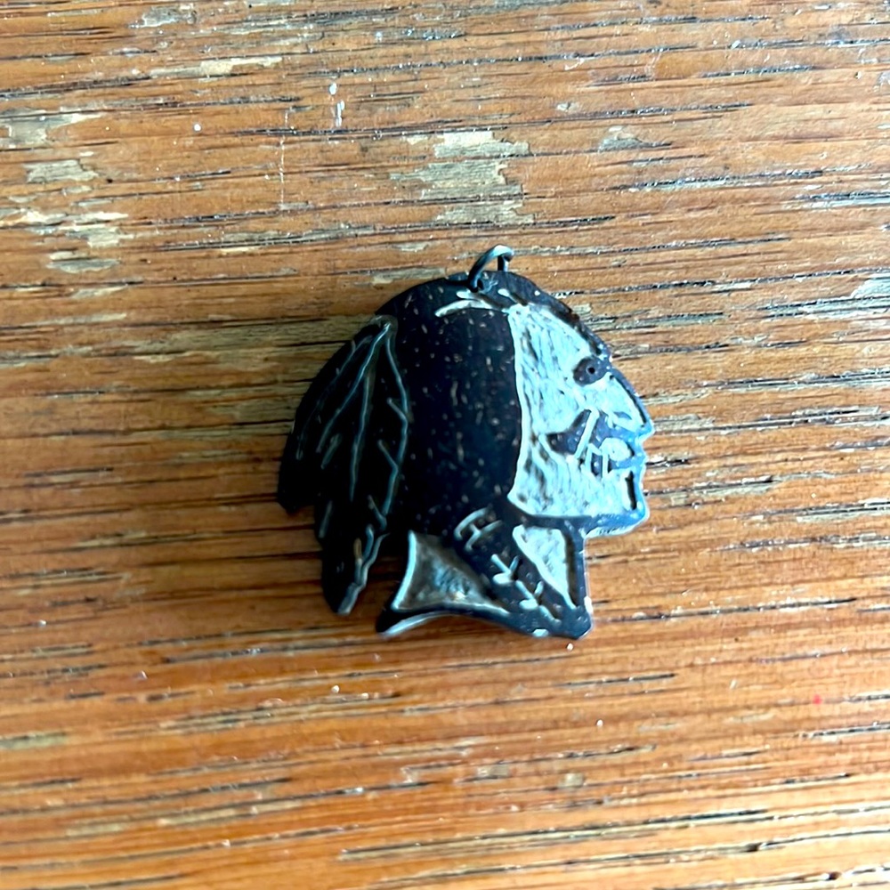 Seminole in headdress coconut shell pendant, EUC